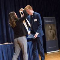 Emily placing a stole on Adam